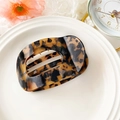 Tortoiseshell acetate hair claw clip with an oval hollow design and elegant leopard pattern - Acetate Dark Leopard Print (10.5cm Round Clip)