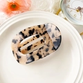 Elegant tortoise shell patterned hair claw clip in a curved hollow oval design - Light Leopard Print Acetate Round Hair Clip (10.5cm)