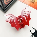 Close-up of red glitter bat hair claw clip with festive Halloween decor on white background - Glitter Red White (10cm)