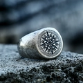 Vintage stainless steel compass signet ring for men on a grey rock background - US Size 7 / Antique Silver