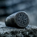 Detailed macro view of vintage stainless steel compass ring with nautical engravings on stone - US Size 7 / Ancient Black