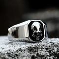 Detailed close-up of a men's punk skull signet ring made of polished stainless steel - US Size 7 / Steel