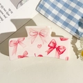 Pink semi-circle hair claw clip featuring sweet bow and heart patterns in a flat lay view - UV Printed Solid Square-Cream White 169-1