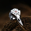 Macro shot of Viking raven skull ring with red gemstone inlay and Vegvisir compass engraving - US Size 7 / Ruby