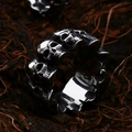 Vintage gothic men's stainless steel skull ring with detailed punk carving on brown background - Gothic Wrap Skull 3D Shape (BR8-738)