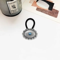 Close-up of vintage turquoise inlay on black elastic hair tie with silver sunburst engraving - Antique Silver 4.5cm Oval Flower Blue Turquoise