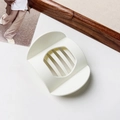 Close-up of a large cream-colored matte hair claw clip for thick hair styling - Matte Creamy White