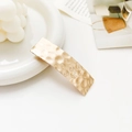 Detail of golden metal rectangular hair clip with hammered texture finish for women - Hammered Crater Rectangle Gold