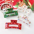 Detail of Christmas claw clips set with Santa and Merry Christmas prints on acrylic finish - Christmas Deer
