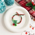 Close-up of Christmas elastic hair band with bell and green tree charm decoration - Christmas Tree