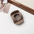Detail of large matte mocha brown hair claw clip with a hollow geometric design - Matte Milk Coffee