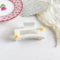 Detailed view of cream resin square hair claw clip with yellow butterfly accents and purple dots - 9cm White Square - Yellow Butterfly