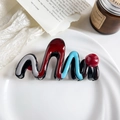 Close-up of wavy color-block hair claw clip with colorful resin design on white plate - Gray/Red/Blue Wavy Claw Clip (10.5cm)
