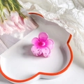 Detail view of a pink resin plumeria hair clip on a white floral ceramic tray - Five-Petal Flower / 4cm / Gradient Pink Purple