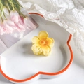 Macro view of small yellow gradient plumeria hair claw on a decorative white tray - Five-Petal Flower / 4cm / Gradient Milky Yellow