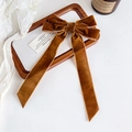 Detail of elegant velvet long ribbon bow hair clip in rich caramel brown color - Caramel