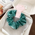 Detail of dark green velvet scrunchie in premium paper box with dried rose decoration - Dark Green