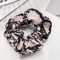 Detailed view of leopard snake print scrunchie in pink and beige chiffon fabric - 11cm / Snake Pattern Pink
