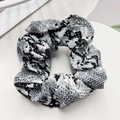 Detailed view of snake skin pattern scrunchie hair tie with pleated fabric texture - 11cm / Snake Pattern Grey