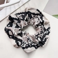 Close-up of leopard print fabric scrunchie with elastic detail and rich texture - 11cm / Light Coffee Snake Print