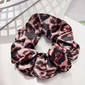 Macro detail of leopard print satin hair scrunchie with silky luster on white texture - 11cm / Pink Round Leopard