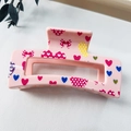 Detailed view of pink rectangular hair claw clip with heart and bow patterns - 8.5cm Heart Print - Style J Pink / PS