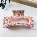 Detail of pink hair claw clip featuring colorful heart prints and sweet slogans - 8.5cm Heart Print - Style K Pink / PS