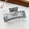 Macro detail of rectangle hair claw clip with black and white spotted leopard print pattern - Leopard Transparent Base