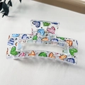 Detail showing a large acrylic hair claw clip with colorful heart patterns and metal spring - 8.5cm Heart Print - Style L Transparent Base / PS