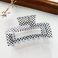 Detail of transparent rectangle hair claw with black polka dots and gold spring mechanism - Small Polka Dot Transparent Base