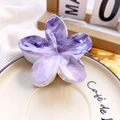 Close-up of purple agate textured flower hair claw clip on a ceramic cafe tray - 8cm UV Printed Plumeria - ABS Beige Style J