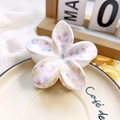 Detailed close-up of frangipani hair claw clip with colorful marble pattern texture - 8cm UV Printed Plumeria - ABS Beige Style O