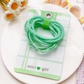 Détail d'élastiques à cheveux côtelés vert menthe sur carte décorative mini girl - Style à Double Brin - Vert
