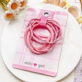 Détail d'élastiques à cheveux roses et nœuds sur une carte de mini girl - Style à Double Brin - Rose