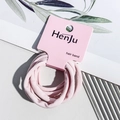 Close-up of pink elastic hair bands set on a minimalist paper card holder - Towel Style / Light Pink