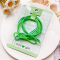 Détail d'un lot d'élastiques à cheveux verts avec nœud sur carte de présentation - Style Nœud en 8 Dégradé - Vert