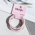 Close-up of pink high-elastic hair bands on a premium card set against a stylish background - Hair Rope Style / Light Pink