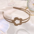 Détail du serre-tête ajouré à fleurs avec dents antidérapantes pour petites filles - Fleur Mate Café Clair