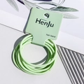 Detail view of light green high elasticity seamless hair ties on branded card packaging - Hair Rope Style / Green