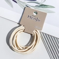 Detail of high-elastic beige seamless hair bands on a minimalist brand display card - Hair Rope Style / Nude