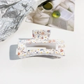 Detailed macro view of a white floral hair claw clip with delicate resin patterns - White Pink Blue Floral (A-5)