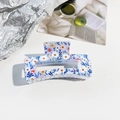 Detailed close-up of floral print hair claw clip with delicate daisy patterns - Translucent Blue Pink Floral (A-6)