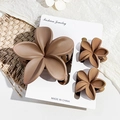 Three-piece set of matte mocha brown flower hair claws on a white display card - Matte Milk Coffee