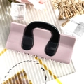 Detail view of pink and black hair claw clip with sturdy teeth on a textured background - Square Bag - Korean Pink