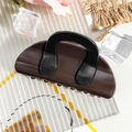 Macro view of a large dark coffee and black textured hair claw clip on a rustic background - Semicircle Bag - Dark Coffee