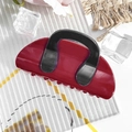 Detail view of burgundy and black color-block hair claw clip on a decorative background - Semicircle Bag - Wine Red