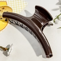 Detail of a large dark coffee hair claw clip with a glossy mirror finish on a stone surface - 14.5cm / Shiny Dark Coffee