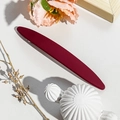 Detail showing matte burgundy hair clip against a minimalist aesthetic background - 11.5cm Long Oval / Matte Wine Red