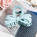 Detail of light blue matte bow hair claw clip showing elegant double-layered design - Matte Light Blue