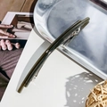 Minimalist olive green acetate spring hair clip on a premium metallic silver tray display - Linear Style / Jelly Dark Gray